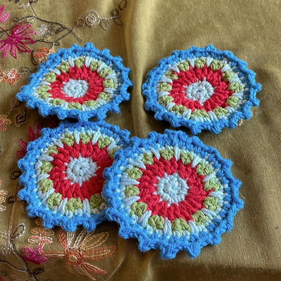 Hand crocheted Mandala coasters in turquoise, green, reddish orange - Picture 1 of 5